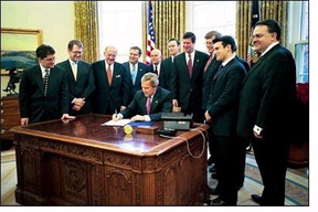 This image has an empty alt attribute; its file name is NNI-signing-by-President-Bush-for-SF.jpg